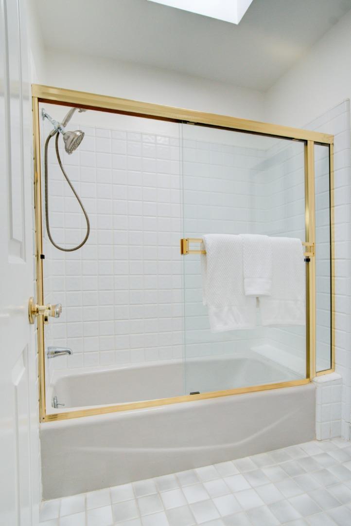 18444 Purdue Drive Saratoga, CA 95070 - Photo 17 of 31 a bathroom with a shower and a bath tub