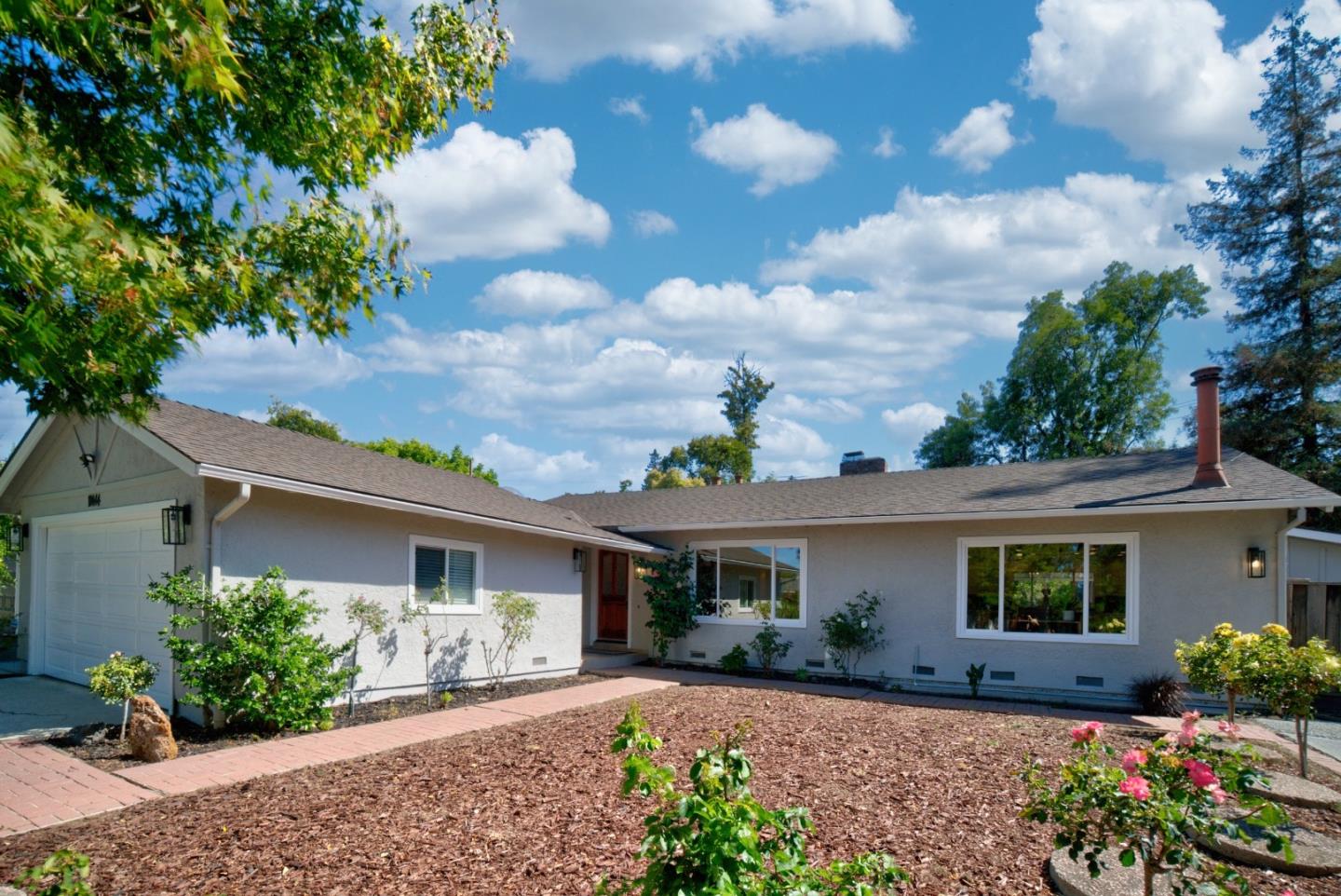 18444 Purdue Drive Saratoga, CA 95070 - Photo 2 of 31 a front view of a house with a garden
