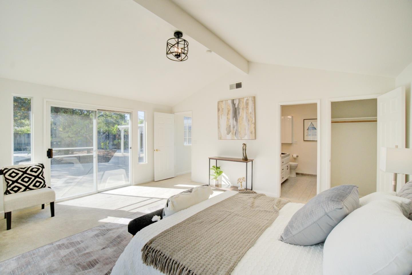 18444 Purdue Drive Saratoga, CA 95070 - Photo 24 of 31 a bedroom with a bed and wooden floor