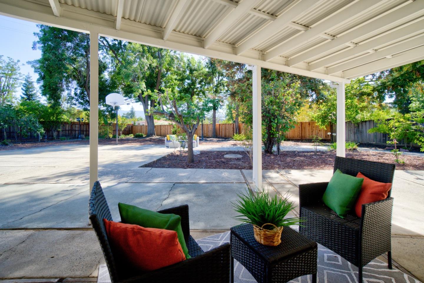 18444 Purdue Drive Saratoga, CA 95070 - Photo 31 of 31 a view of a patio with a table chairs and a backyard