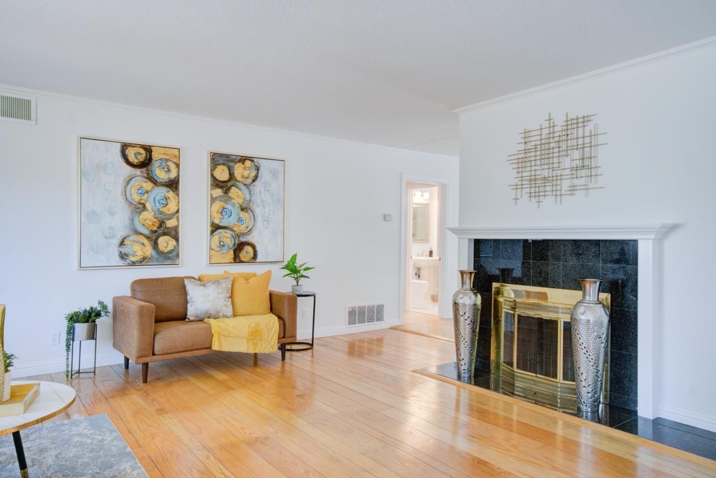 18444 Purdue Drive Saratoga, CA 95070 - Photo 5 of 31 a living room with furniture and a fireplace