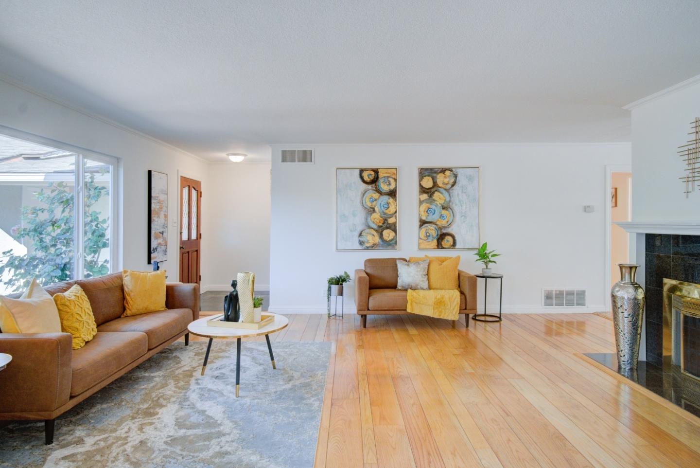 18444 Purdue Drive Saratoga, CA 95070 - Photo 6 of 31 a living room with furniture and a flat screen tv