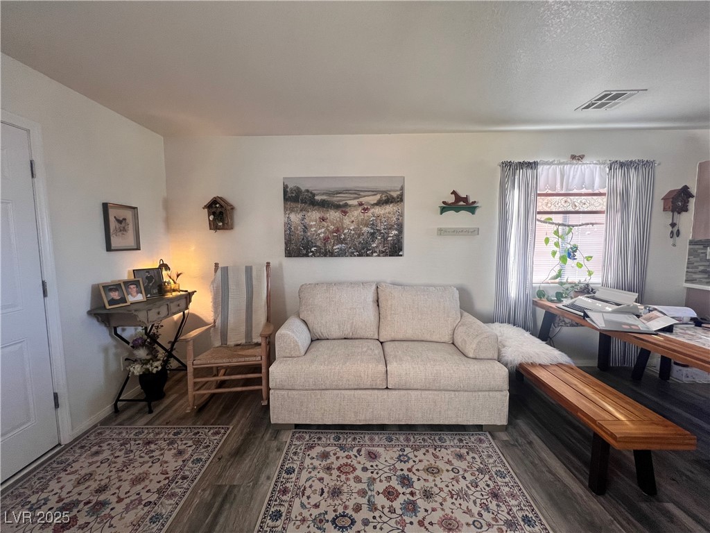 2970 Rio Rico Drive Pahrump, NV 89048 - Photo 12 of 53 Living room featuring wood finished floors and a textured ceiling