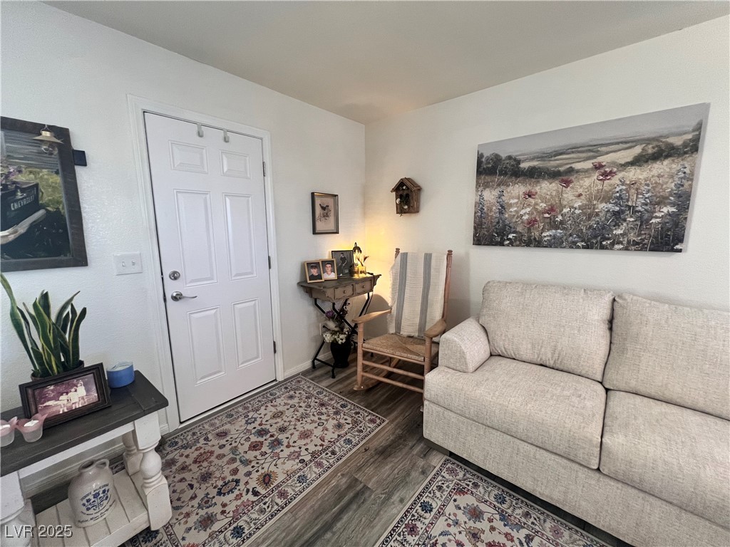 2970 Rio Rico Drive Pahrump, NV 89048 - Photo 17 of 53 Living room with dark wood-style floors and baseboards