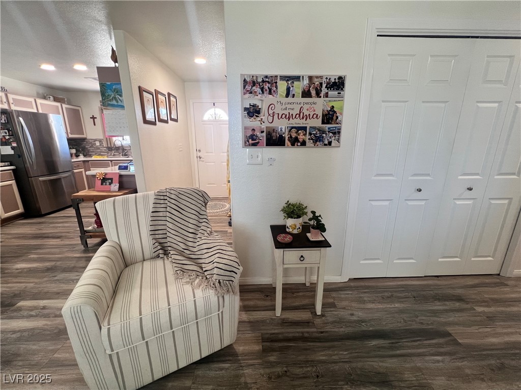 2970 Rio Rico Drive Pahrump, NV 89048 - Photo 22 of 53 Living area featuring dark wood-type flooring, a textured ceiling, and recessed lighting
