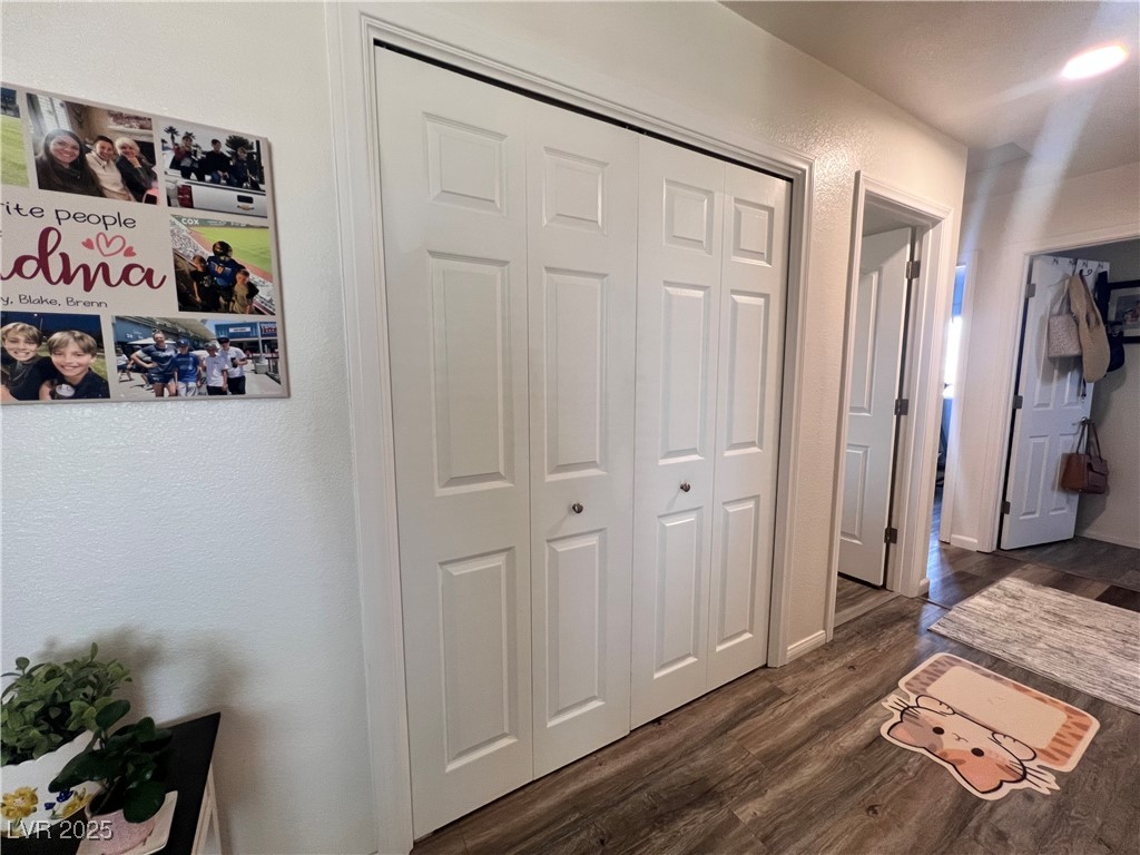 2970 Rio Rico Drive Pahrump, NV 89048 - Photo 24 of 53 Hall with dark wood-style flooring and a textured wall