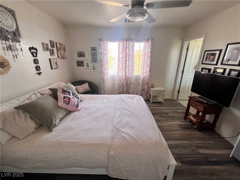 2970 Rio Rico Drive Pahrump, NV 89048 - Photo 30 of 53 Bedroom featuring dark wood finished floors and a ceiling fan