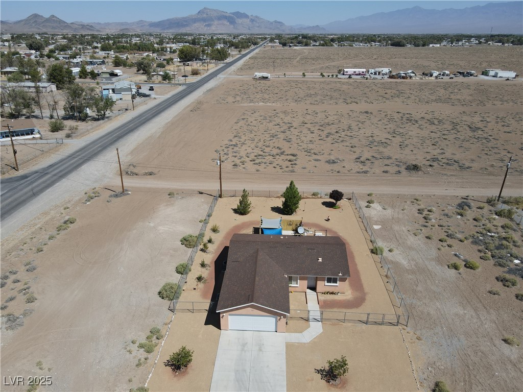 2970 Rio Rico Drive Pahrump, NV 89048 - Photo 3 of 53 View of rural area with a mountainous background and a desert landscape