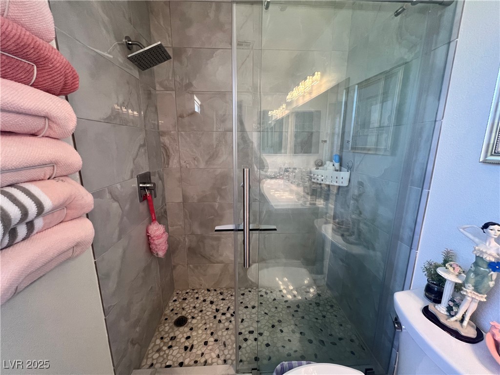 2970 Rio Rico Drive Pahrump, NV 89048 - Photo 32 of 53 Full bathroom featuring a shower stall and toilet