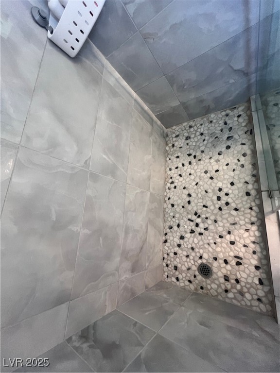 2970 Rio Rico Drive Pahrump, NV 89048 - Photo 34 of 53 Bathroom featuring a tile shower and tile walls