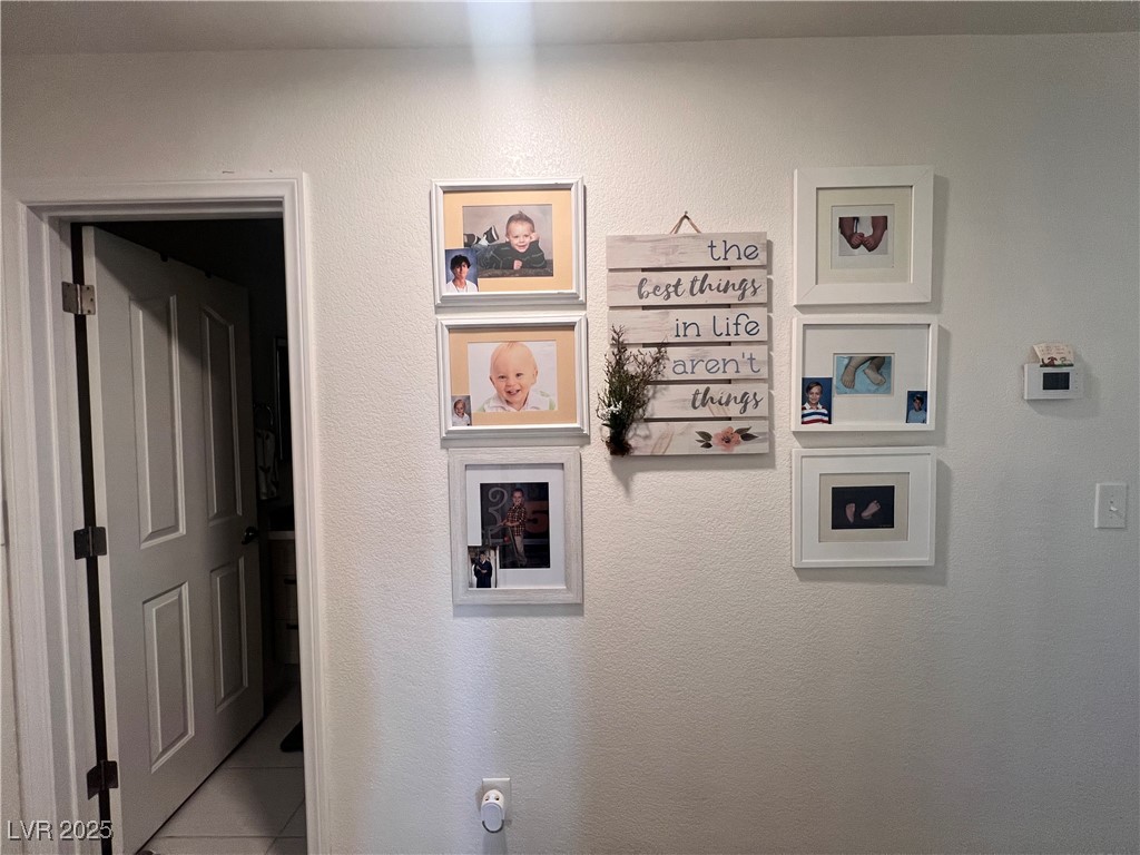 2970 Rio Rico Drive Pahrump, NV 89048 - Photo 35 of 53 Hall featuring a textured wall and tile patterned floors