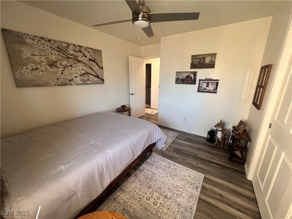 2970 Rio Rico Drive Pahrump, NV 89048 - Photo 43 of 53 Bedroom featuring dark wood finished floors and ceiling fan
