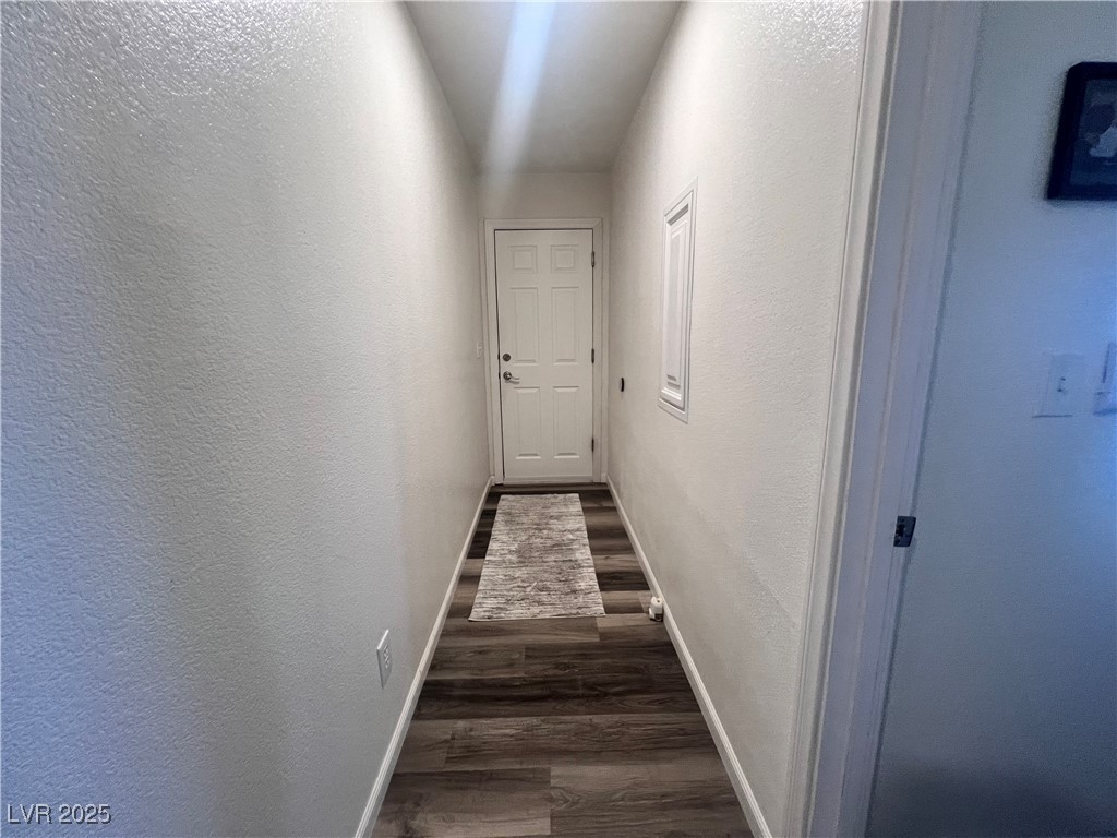 2970 Rio Rico Drive Pahrump, NV 89048 - Photo 44 of 53 Corridor featuring wood finished floors and a textured wall