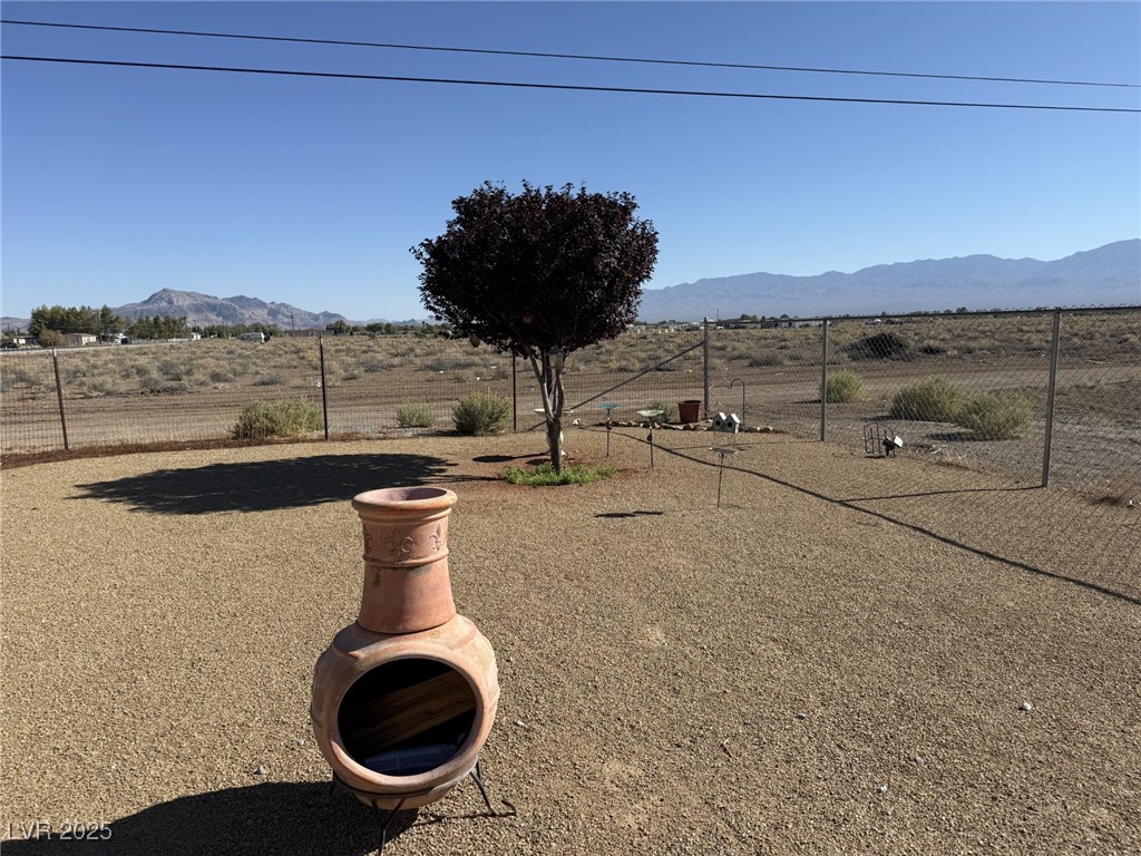 2970 Rio Rico Drive Pahrump, NV 89048 - Photo 47 of 53 View of yard with a mountain view and a rural view