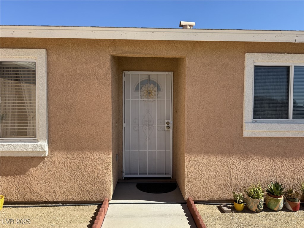 2970 Rio Rico Drive Pahrump, NV 89048 - Photo 7 of 53 Entrance to property featuring stucco siding