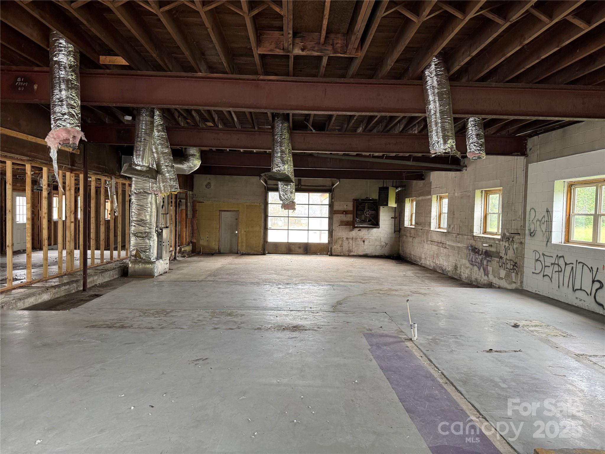 280 South Broad Street Brevard, NC 28712 - Photo 17 of 20 a view of an empty room with wooden building