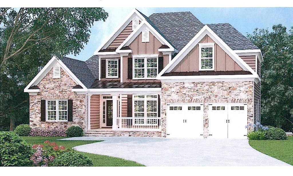 front view of a house with a yard