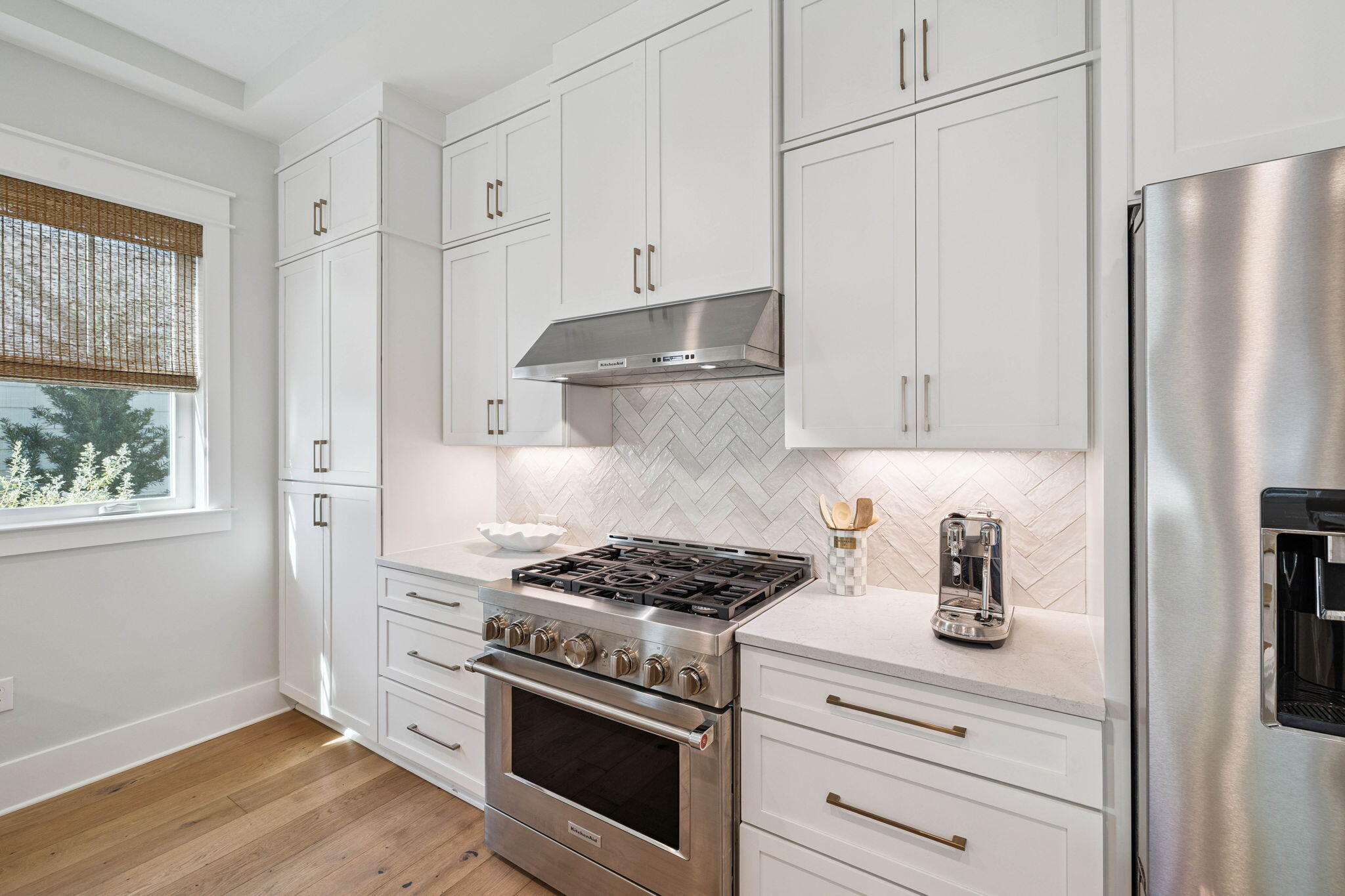 64 White Cottage Road Santa Rosa Beach, FL 32459 - Photo 13 of 35 a kitchen with stainless steel appliances white cabinets and a stove