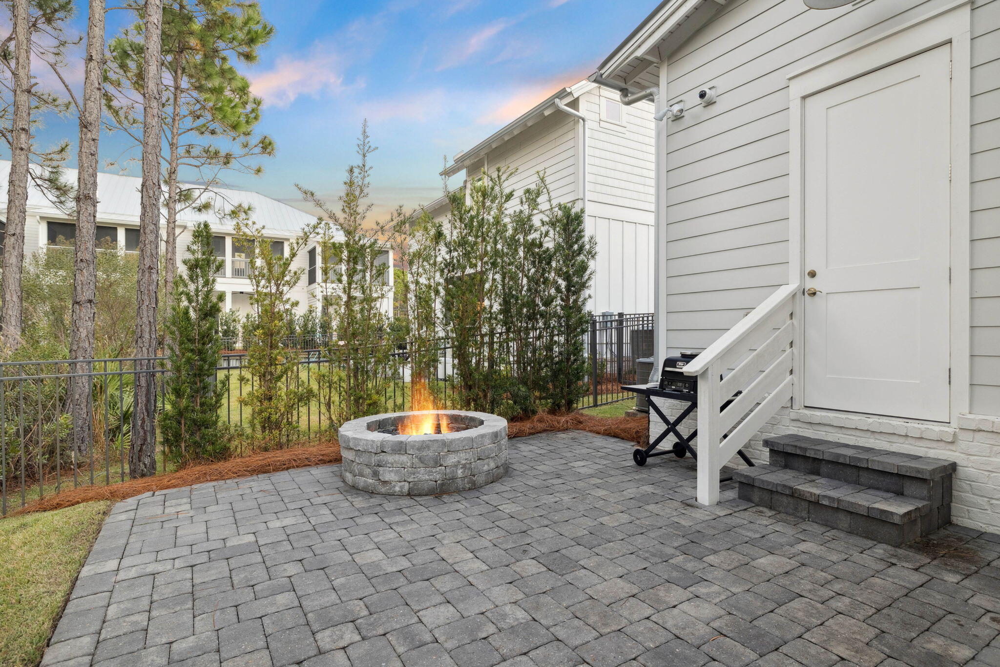 64 White Cottage Road Santa Rosa Beach, FL 32459 - Photo 21 of 35 a view of a patio with a table and chairs