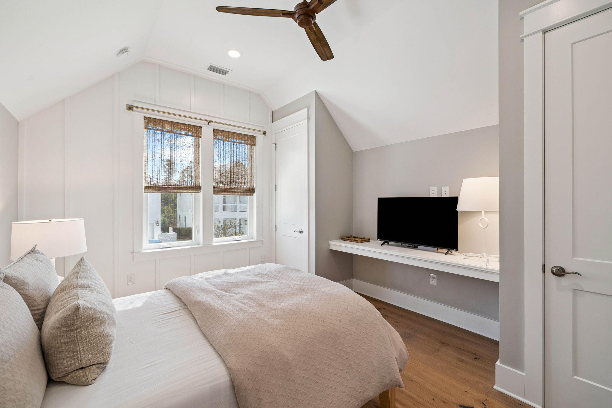 64 White Cottage Road Santa Rosa Beach, FL 32459 - Photo 27 of 35 a bedroom with a bed and a flat screen tv