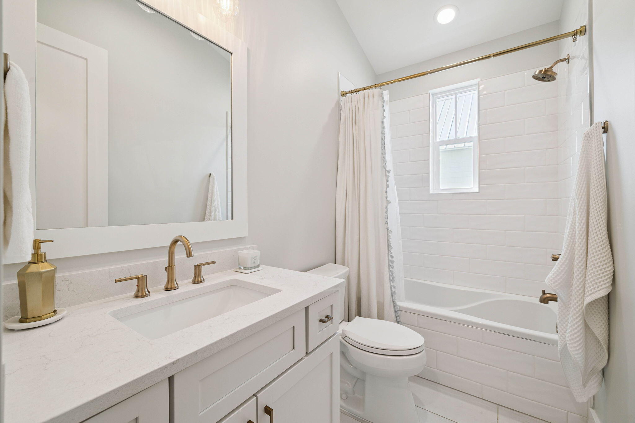 64 White Cottage Road Santa Rosa Beach, FL 32459 - Photo 28 of 35 a bathroom with a sink a toilet and a mirror