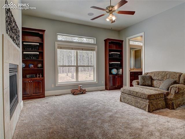 15925 Winding Trail Road Colorado Springs, CO 80908 - Photo 19 of 36 One of Two Main Level Master Suites- This One Features a Sitting Area with Fireplace and 5pc Bath