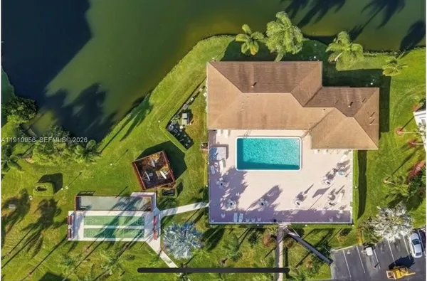 an aerial view of a house with a garden