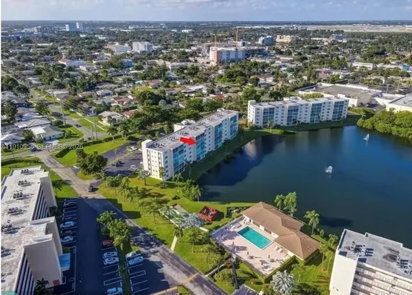 an aerial view of a house with a lake view