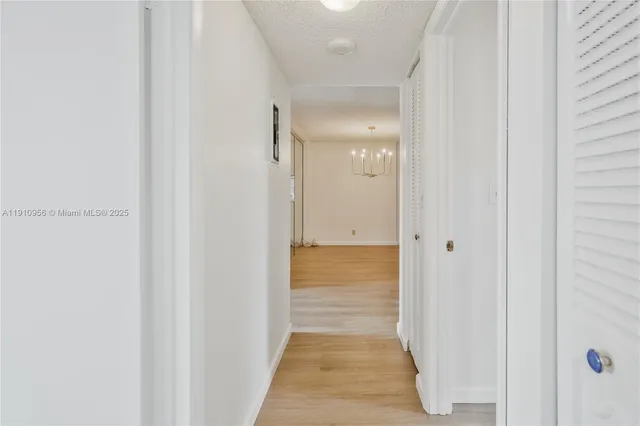 a view of a bathroom from the hallway