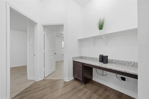 a kitchen with stainless steel appliances granite countertop a sink and a stove