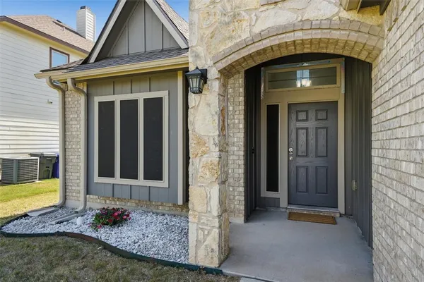 a front view of a house with garage