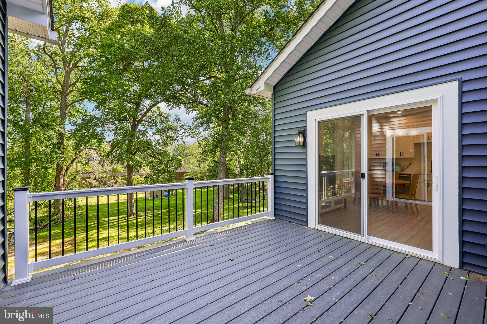 4315 Pinetree Road Rockville, MD 20853 - Photo 11 of 28 a view of backyard with deck and wooden floor