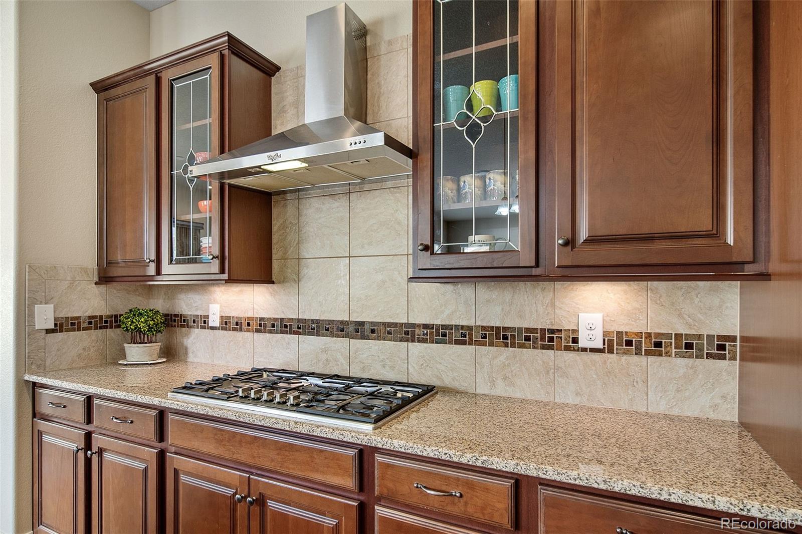 17670 West 94th Drive Arvada, CO 80007 - Photo 16 of 49 a kitchen with granite countertop a sink and cabinets