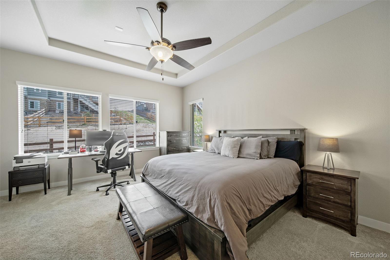 17670 West 94th Drive Arvada, CO 80007 - Photo 20 of 49 a bedroom with a bed and wooden floor