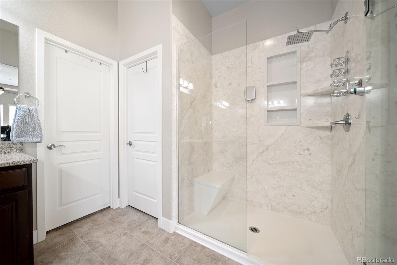 17670 West 94th Drive Arvada, CO 80007 - Photo 26 of 49 a bathroom with a shower