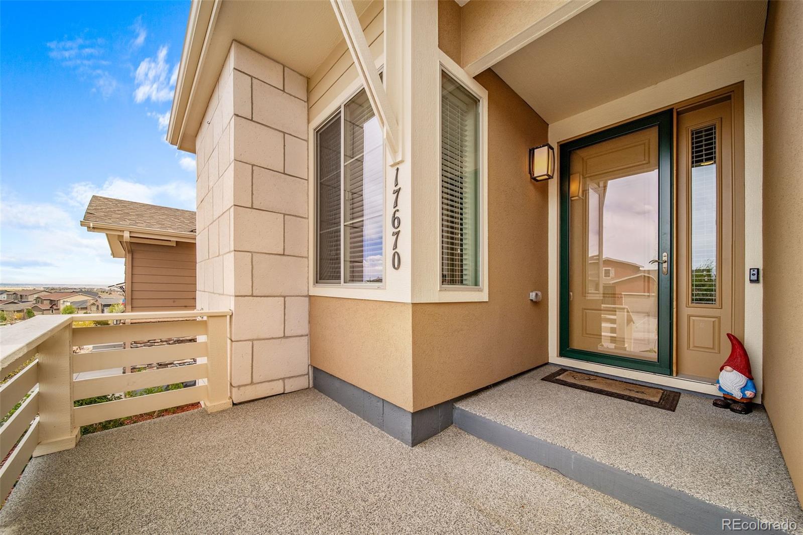 17670 West 94th Drive Arvada, CO 80007 - Photo 3 of 49 a view of an empty room with windows