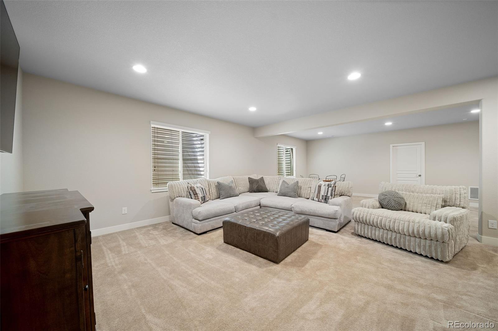 17670 West 94th Drive Arvada, CO 80007 - Photo 34 of 49 a living room with furniture and a window