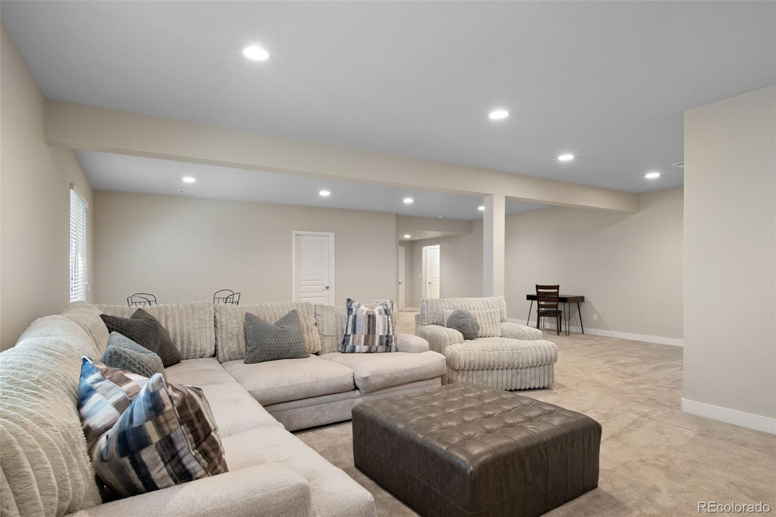 17670 West 94th Drive Arvada, CO 80007 - Photo 35 of 49 a living room with furniture and a couch