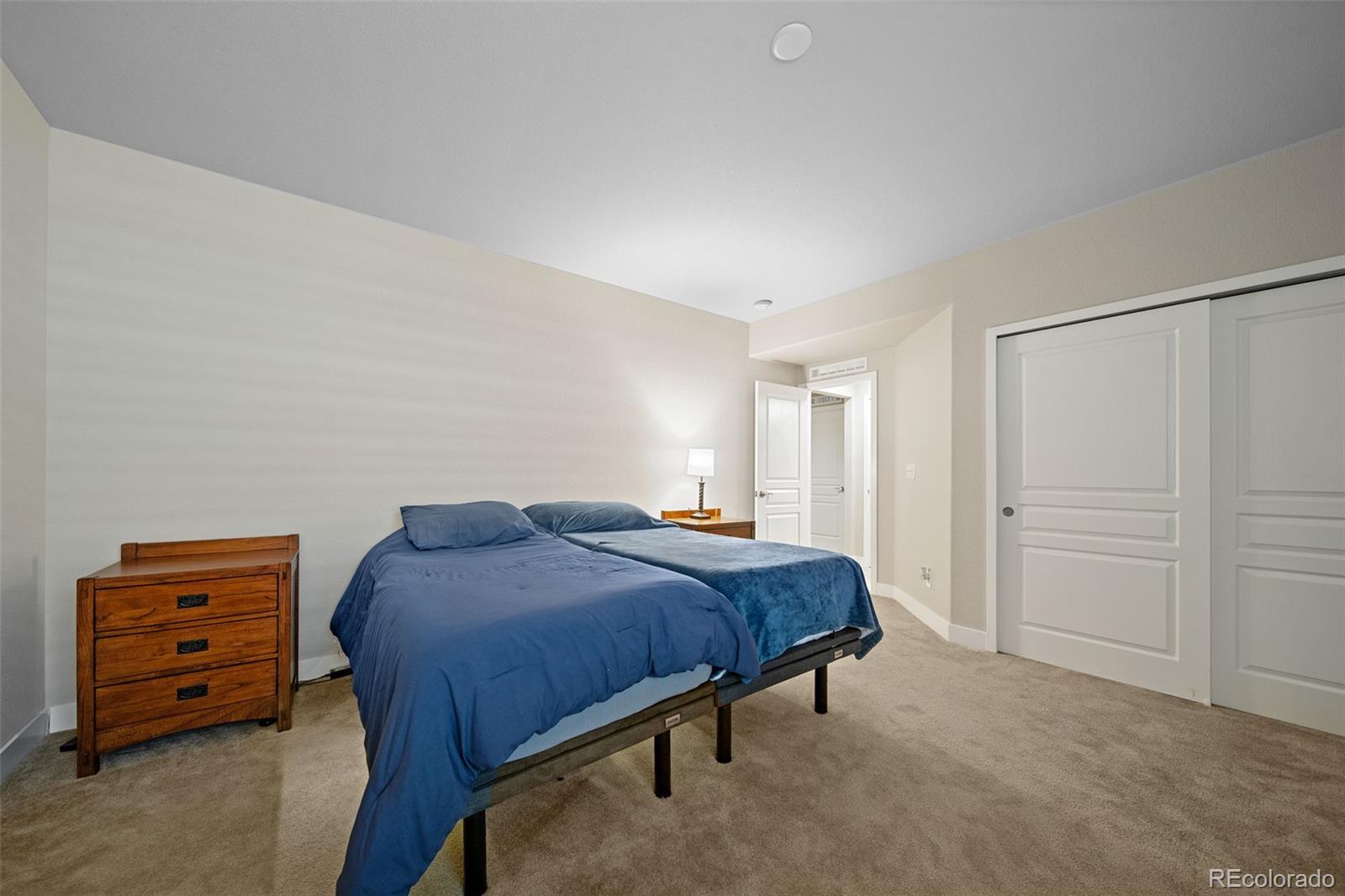 17670 West 94th Drive Arvada, CO 80007 - Photo 38 of 49 a bedroom with a bed and a closet