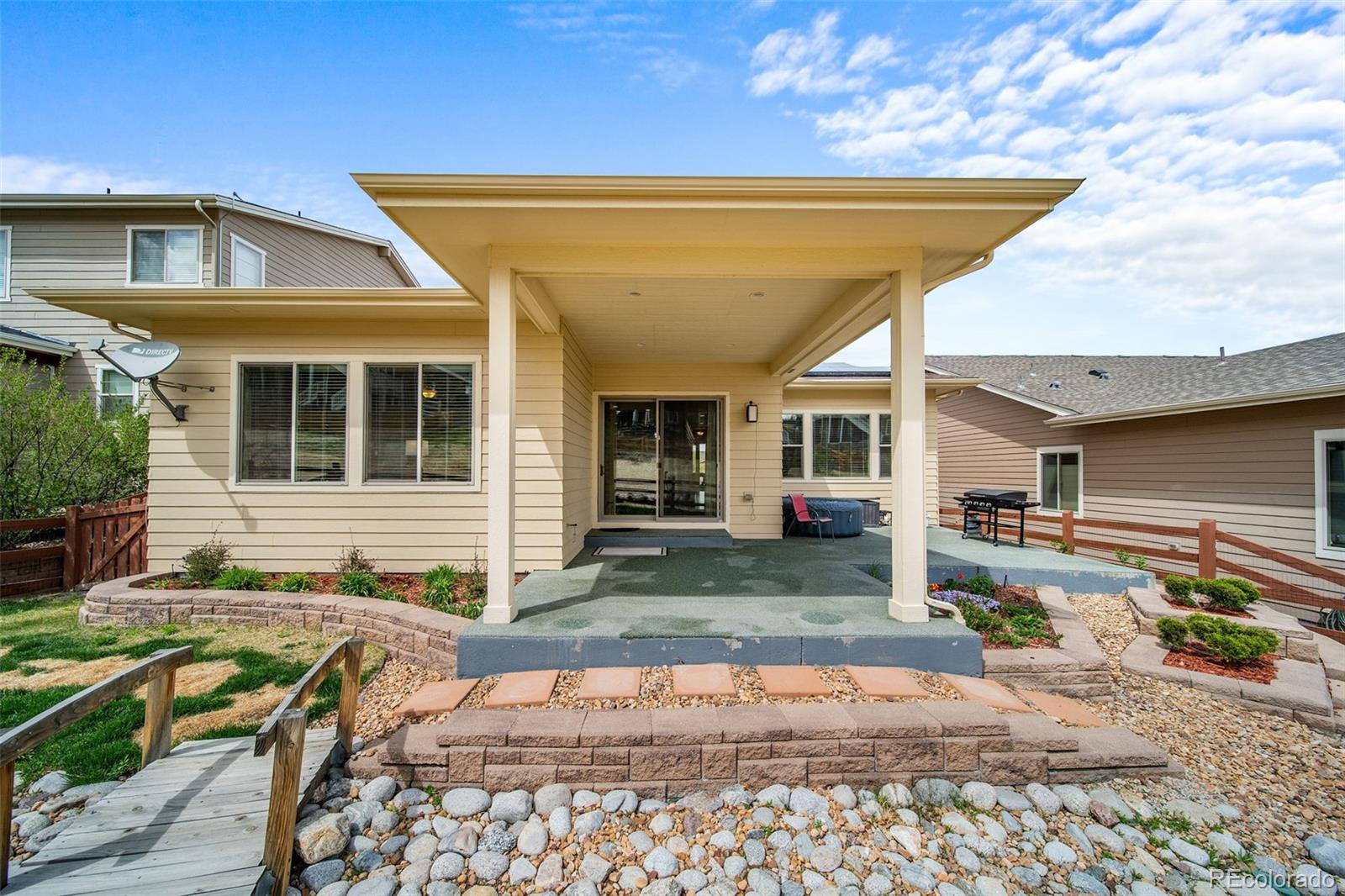 17670 West 94th Drive Arvada, CO 80007 - Photo 41 of 49 a front view of a house with garden