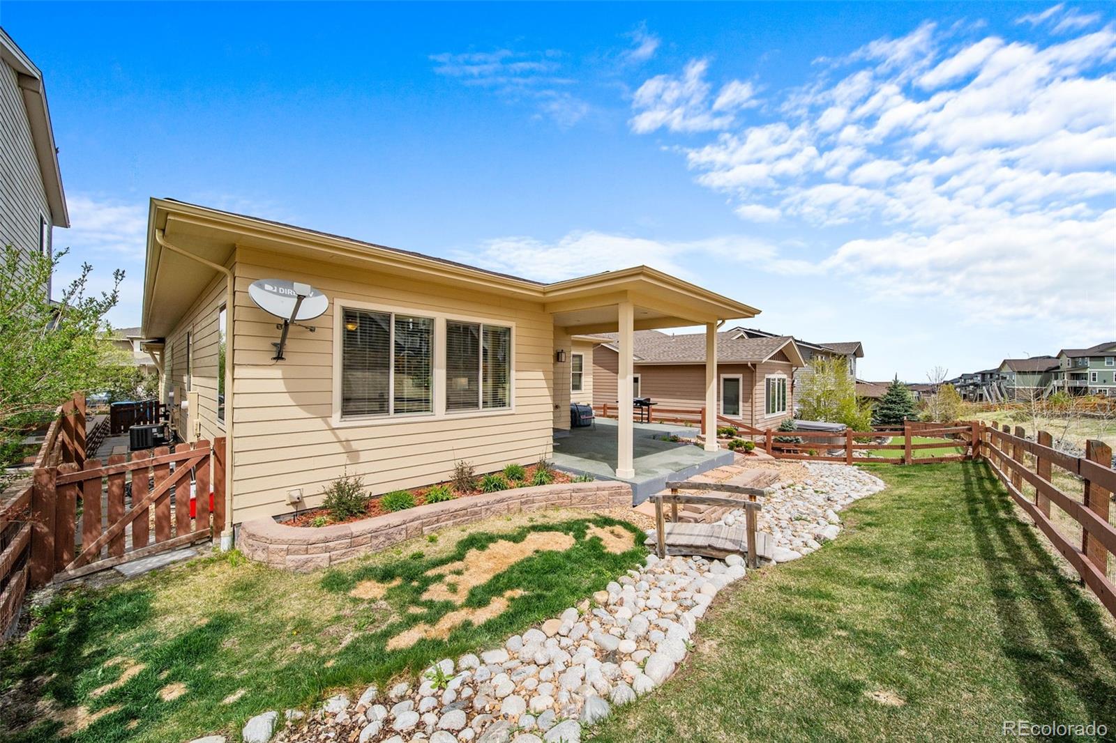 17670 West 94th Drive Arvada, CO 80007 - Photo 43 of 49 a view of a house with backyard porch and sitting area