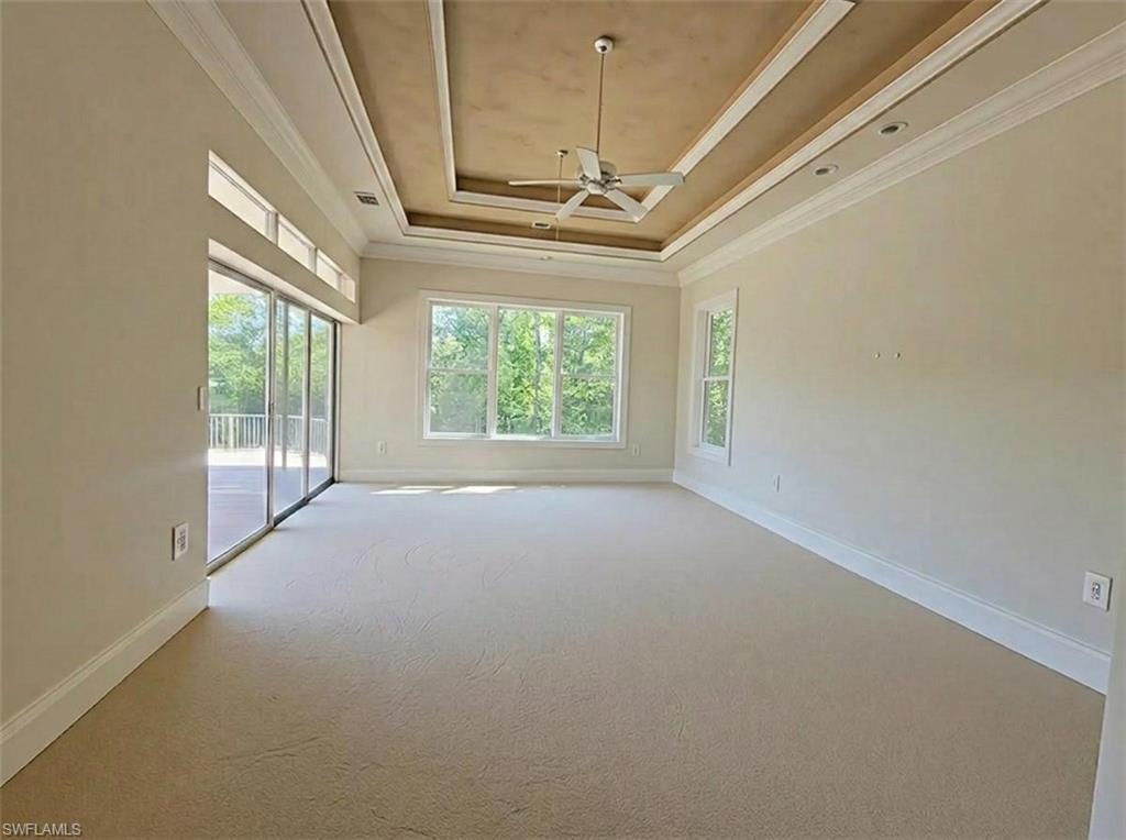 1269 Pocantico Lane Naples, FL 34110 - Photo 12 of 45 a view of entryway and hall with a chandelier