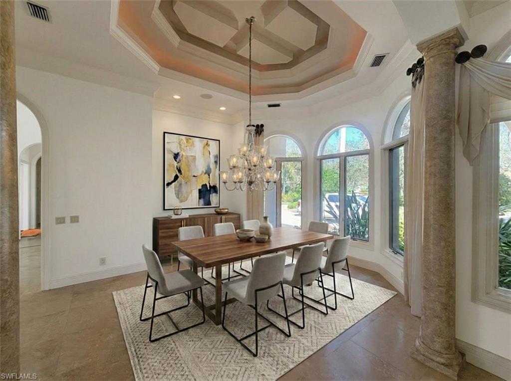 1269 Pocantico Lane Naples, FL 34110 - Photo 17 of 45 a view of a dining room with furniture window and wooden floor
