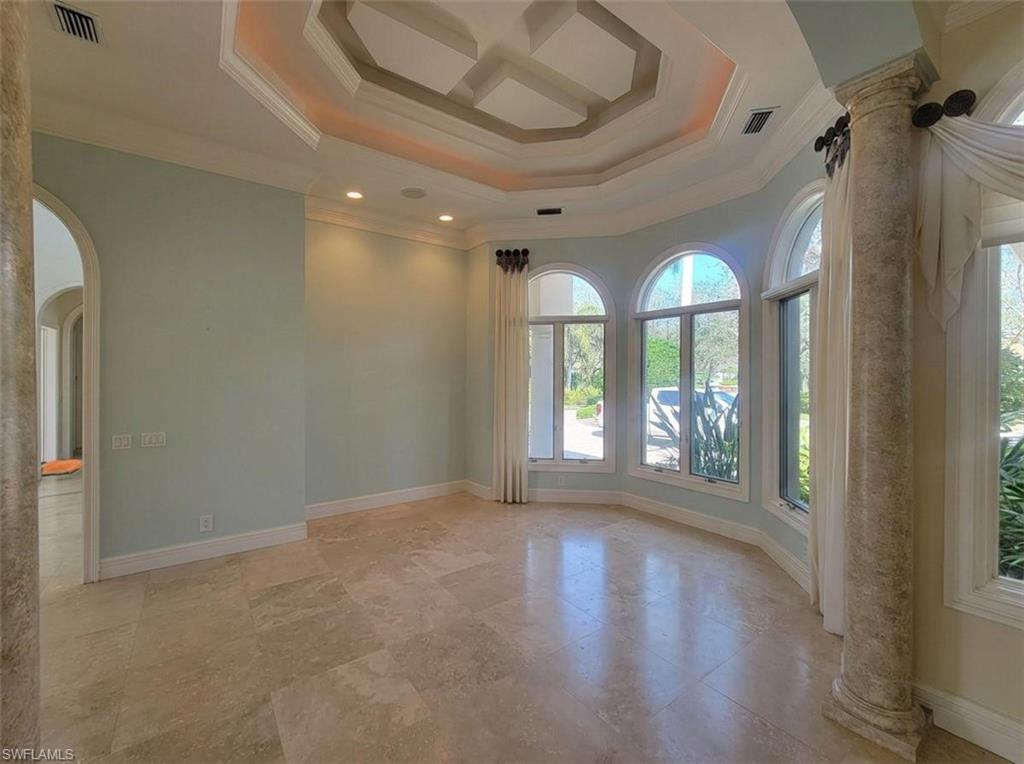 1269 Pocantico Lane Naples, FL 34110 - Photo 18 of 45 wooden floor in an empty room with a window