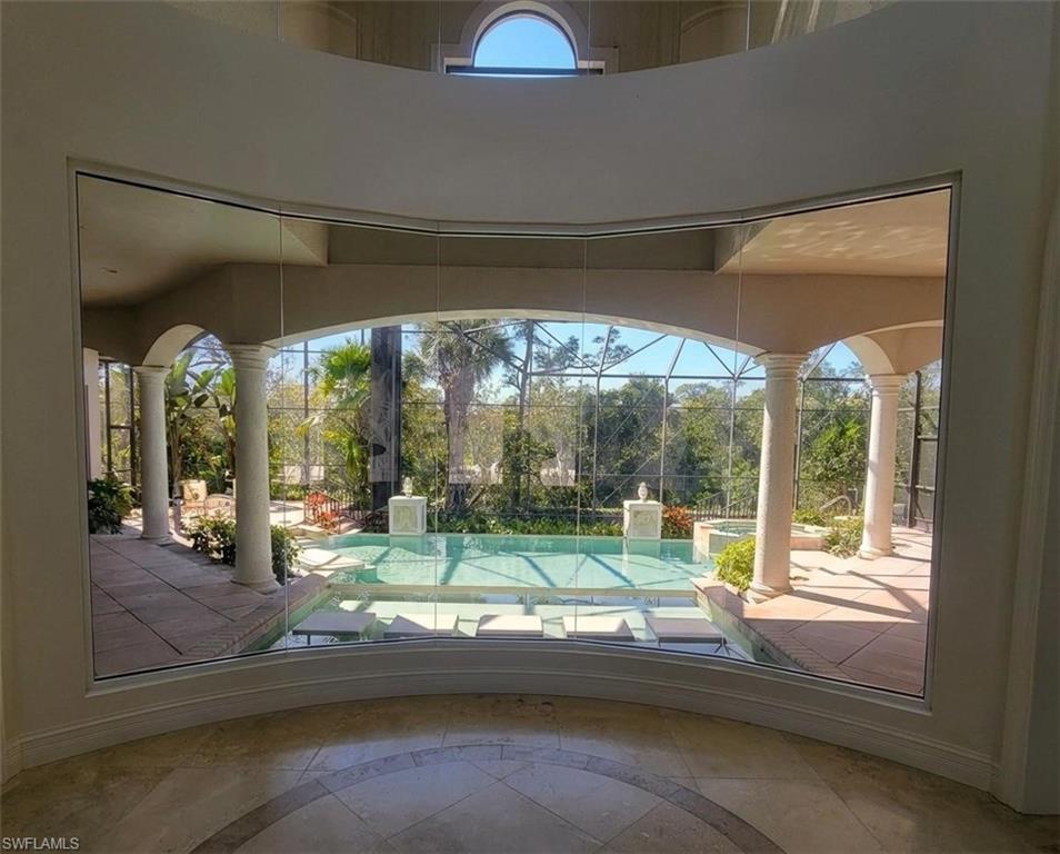 1269 Pocantico Lane Naples, FL 34110 - Photo 20 of 45 a view of porch with a yard