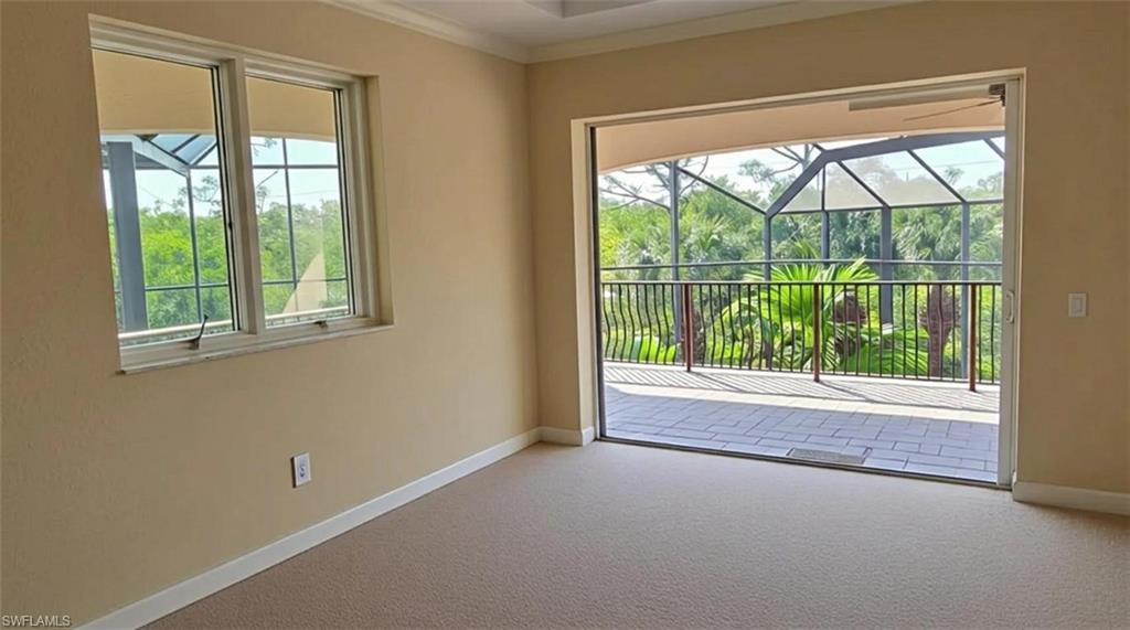 1269 Pocantico Lane Naples, FL 34110 - Photo 22 of 45 an empty room with wooden floor and windows