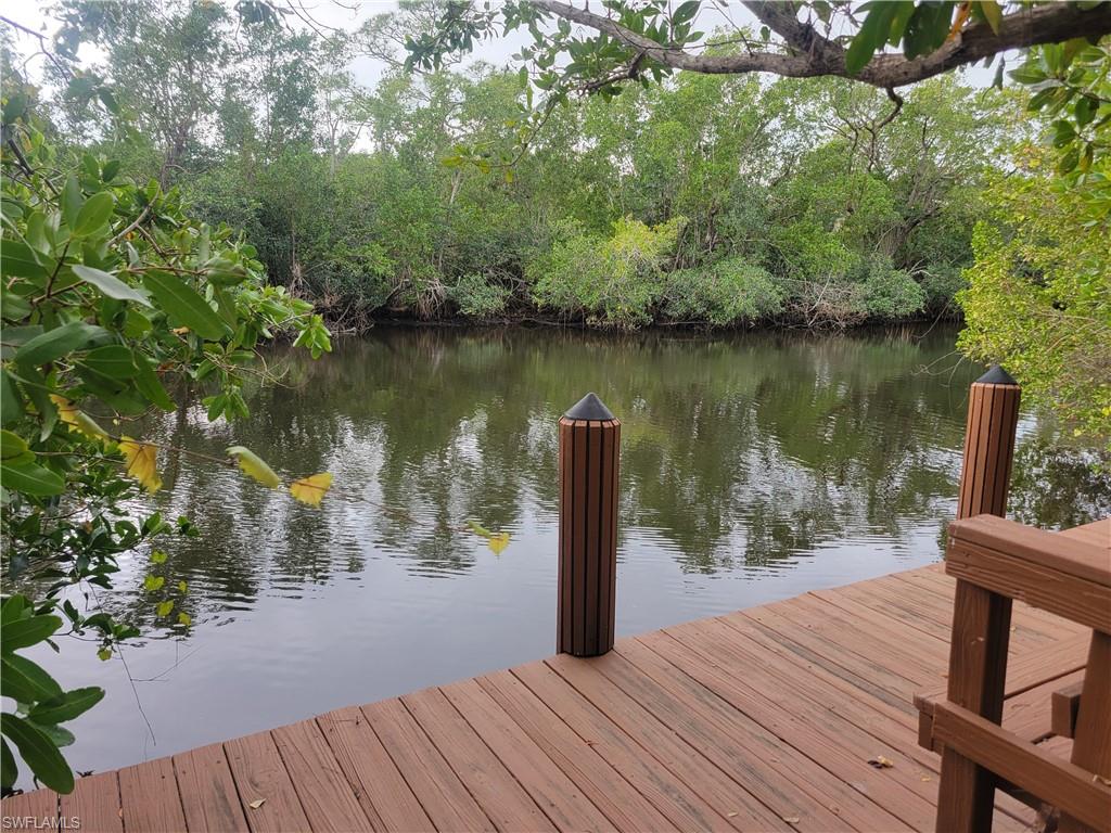1269 Pocantico Lane Naples, FL 34110 - Photo 25 of 45 a lake view with a wooden floor and lake view