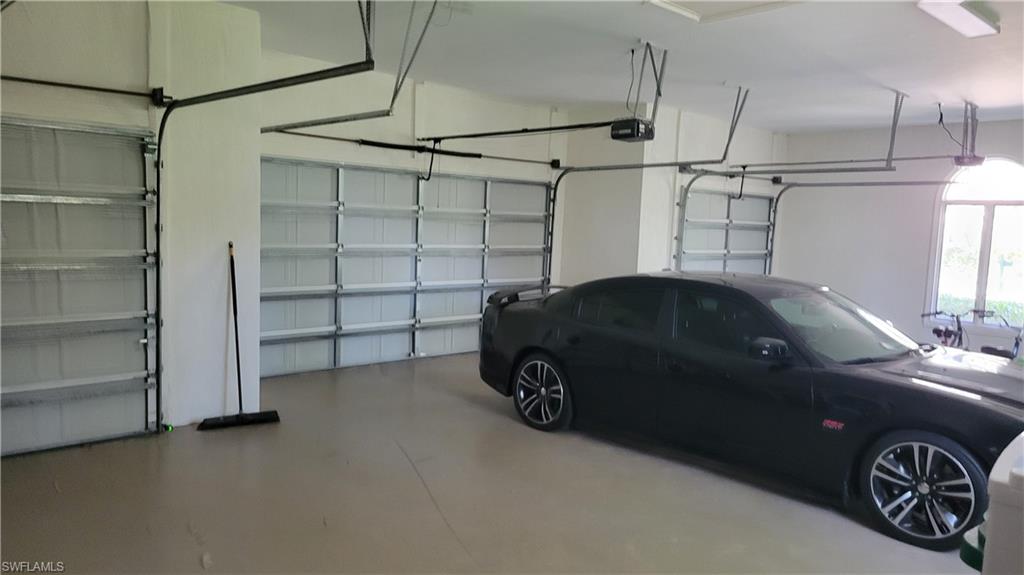1269 Pocantico Lane Naples, FL 34110 - Photo 28 of 45 a car parked in a garage