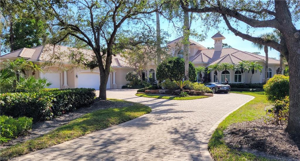 1269 Pocantico Lane Naples, FL 34110 - Photo 3 of 45 a view of a house with swimming pool and a large tree