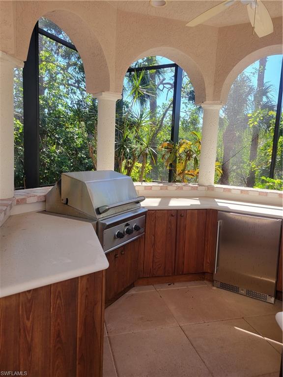 1269 Pocantico Lane Naples, FL 34110 - Photo 36 of 45 a kitchen that has a stove and a microwave